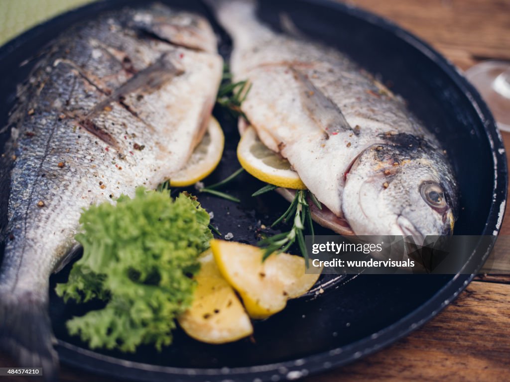 Fish grilled with a stuffing of lemon and rosemary