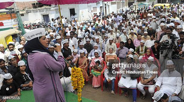 Leader Shazia Ilmi addresses a gathering during a road show to solicit votes for party candidate Anil Trivedi at Ghafoor Khan ki Bazaria on April 13,...