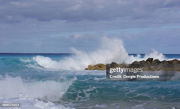 ocean crashing on rocks - san salvador stock pictures, royalty-free photos & images