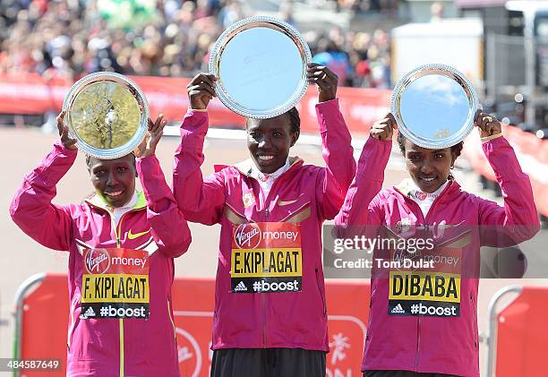 Women's Elite winner Edna Kiplagat of Kenya poses with second placed Florence Kipalgat of Kenya and third placed Tirunesh Dibaba of Ethiopia...