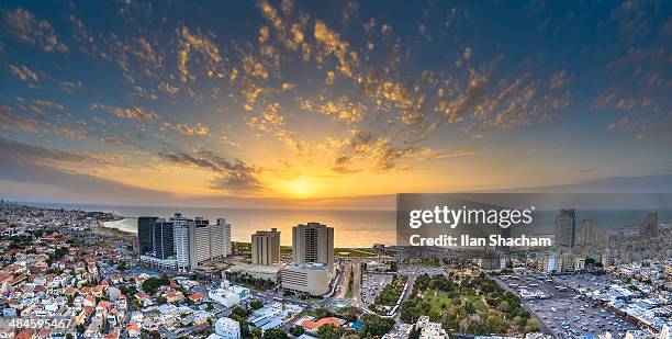 sunset over tel-aviv beach - tel aviv stock-fotos und bilder