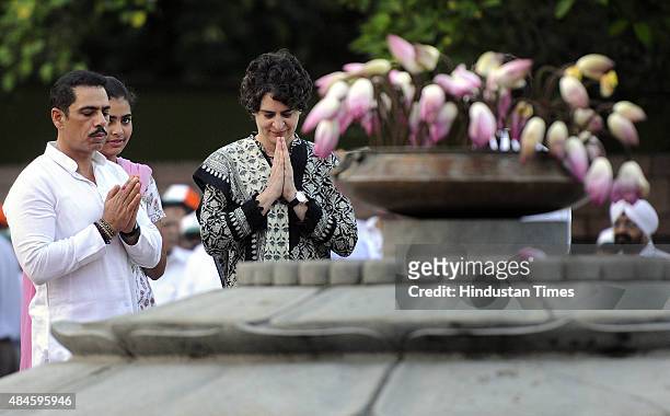 Former Prime Minister Rajiv Gandhi's daughter Priyanka Gandhi along with her husband Robert Vadra and daughter Miraya, paying floral tribute during a...