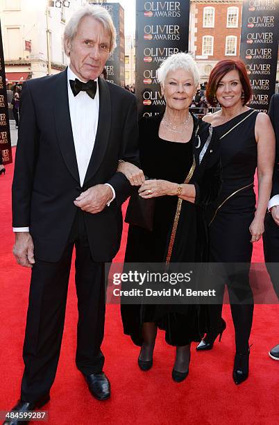 David Mills, Dame Judi Dench and Finty Williams attend the Laurence Olivier Awards at The Royal Opera House on April 13, 2014 in London, England.