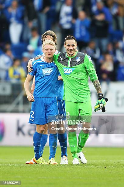 Andreas Beck celebrates winning with goalkeeper Jens Grahl of Hoffenheim during the Bundesliga match between 1899 Hoffenheim and FC Augsburg at...