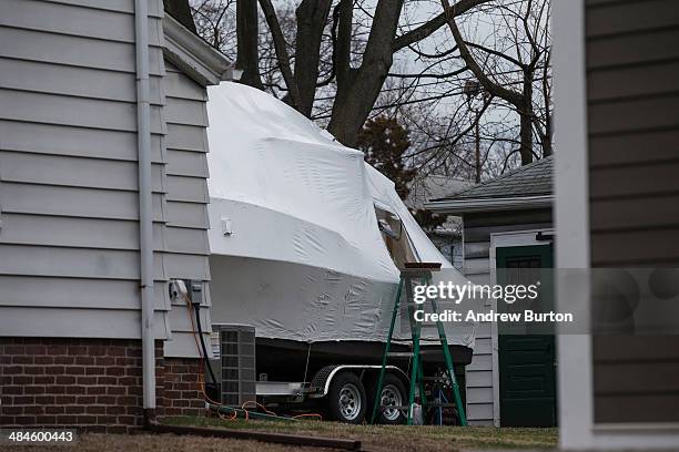 Boat is seen in the back driveway of 67 Franklin Street, where one year ago, the surviving Boston bomber Dzhokhar Tsarnaev was found hiding in a boat...