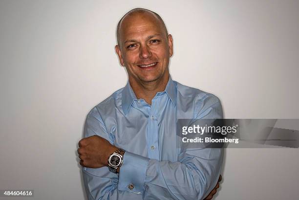 Tony Fadell, co-founder and chief executive officer of Nest Inc., stands for a photograph while wearing a Patek Philippe Nautilus ref. 5990...