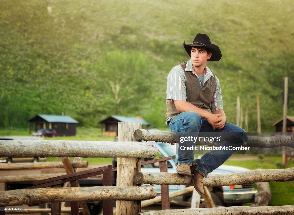 Cowboy Sitting On Log Fence At Ranch In Montana Usa High-Res Stock Photo -  Getty Images