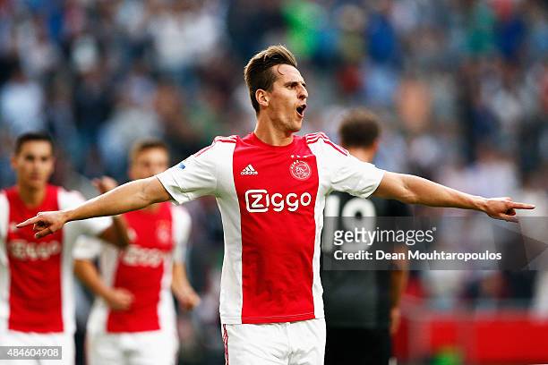 Arkadiusz Milik of Ajax celebrates scoring his teams first goal of the game from the penalty spot during the UEFA Europa League play off round 1st...