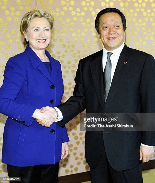 Secretary of States Hillary Clinton and Japanese Defense Minister Yasukazu Hamada shake hands prior to their meeting at IIkura Guest House on...