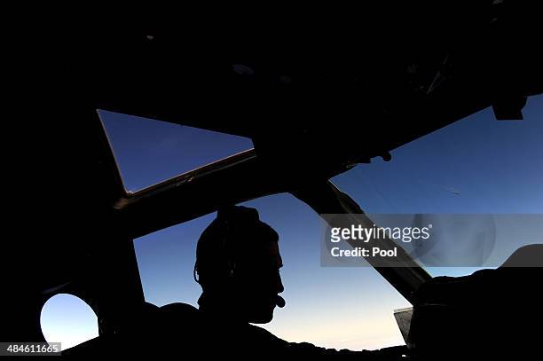 Pilot and aircraft captain, Flight Lieutenant Timothy McAlevey of the Royal New Zealand Airforce P-3K2-Orion aircraft, flies his plane during the...