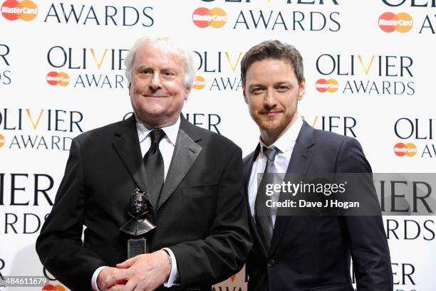 Richard Eyre with his Best Revival award for Ghosts with award presenter James McAvoy during the Laurence Olivier Awards at the Royal Opera House on...