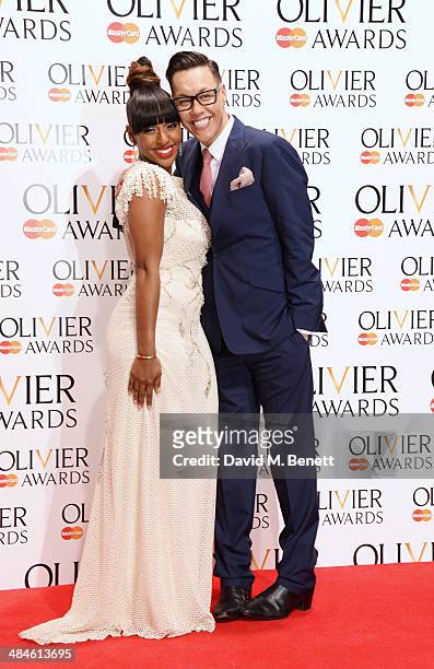 Presenters Alexandra Burke and Gok Wan pose in the press room at the Laurence Olivier Awards at The Royal Opera House on April 13, 2014 in London,...