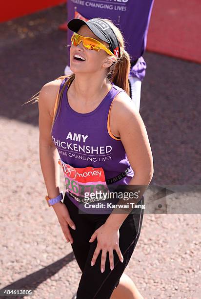 Amy Willerton crosses the finish line to complete the 2014 London Marathon on April 13, 2014 in London, England.