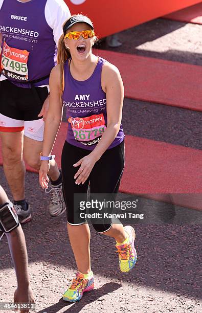 Amy Willerton crosses the finish line to complete the 2014 London Marathon on April 13, 2014 in London, England.