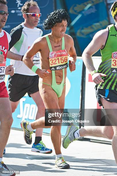 Runner dressed in a green Mankini passes by the Cutty Sark in Greenwich in the 2014 London Marathon on April 13, 2014 in London, England.