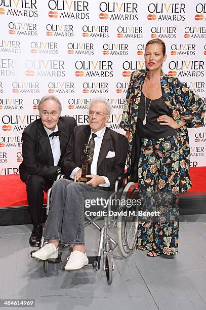 Michael White , winner of the Special Award, poses in the press room with presenters Nigel Planer and Kate Moss at the Laurence Olivier Awards at The...