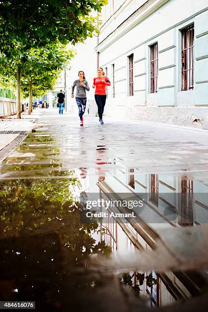 morning workout - puddle reflection stock pictures, royalty-free photos & images