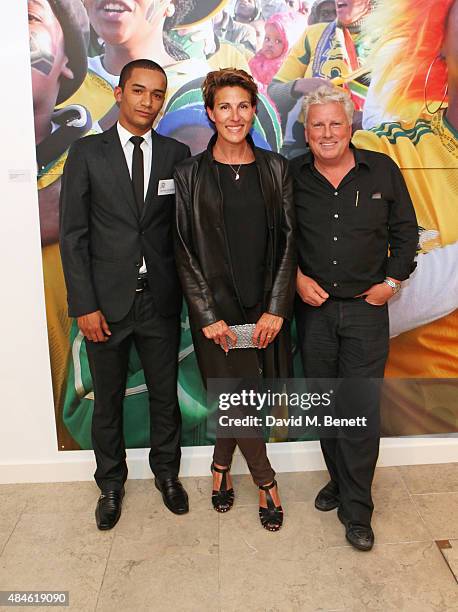 Photographer Joao Paulo Lima, Tamsin Greig and David Westhead attend a private view of "Wembley 2 Soweto", an exhibition of images shot by...
