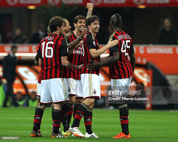 Riccardo Montolivo of AC Milan celebrates with his team-mates Andrea Poli, Ricardo Kaka and Mario Balotelli after scoring the opening goal during the...