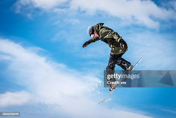 snowboarder at jump - man snow wind stock pictures, royalty-free photos & images