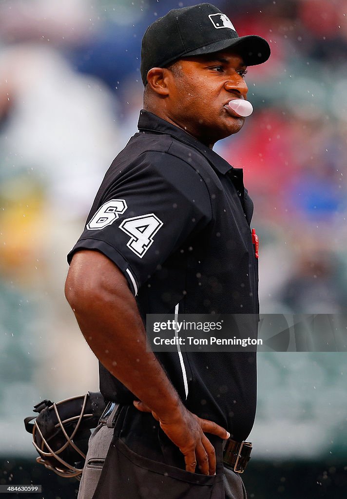 Umpire Alan Porter blows a bubble before the Texas Rangers take on Umpire Alan Porter blows a bubble before the Texas Rangers take on
