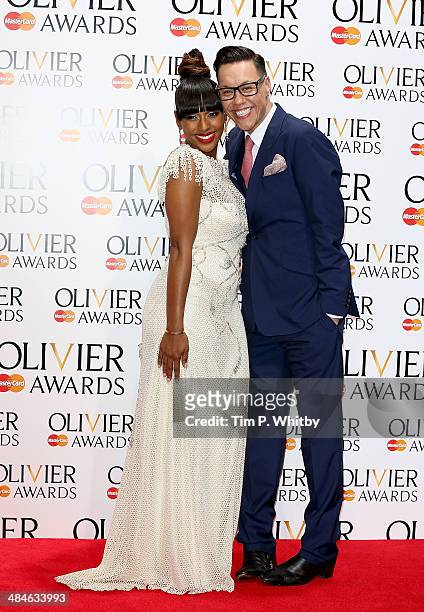 Alexandra Burke and Gok Wan poses in the press room at the Laurence Olivier Awards at The Royal Opera House on April 13, 2014 in London, England.