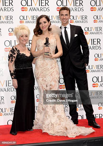 Zrinka Cvitesic with her Best Actress in a Musical award for Once with award presenters Barbara Windsor and Richard Fleeshman during the Laurence...