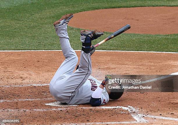Nick Swisher of the Cleveland Indians falls over after fouling a ball off of his foot against the Chicago White Sox at U.S. Cellular Field on April...