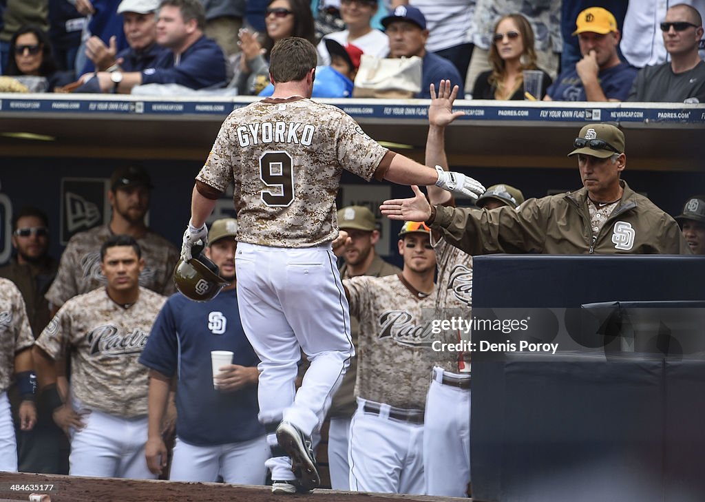 Jedd Gyorko of the San Diego Padres is congratulated after hitting