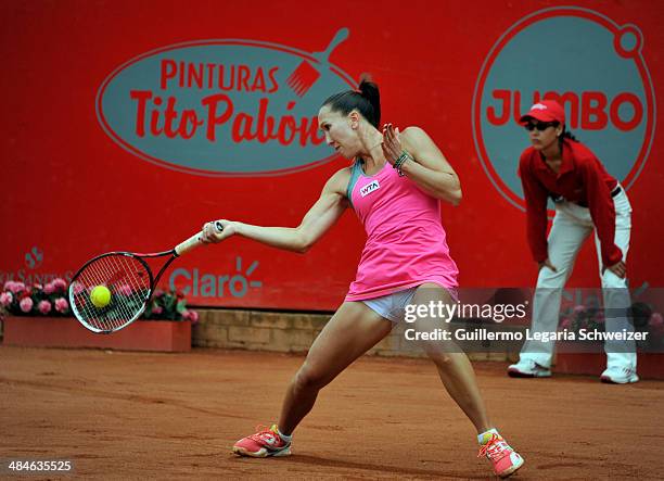 Jelena Jakovic of Serbia returns the ball to Caroline Garcia of France, during their WTA Bogota Open final match at El Rancho Club on April 13, 2014...