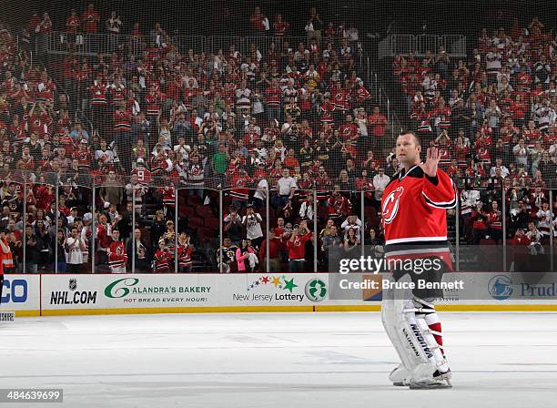 Martin Brodeur of the New Jersey Devils salutes the fan while leaving the ice following a 3-2 victory over the Boston Bruins at the Prudential Center...
