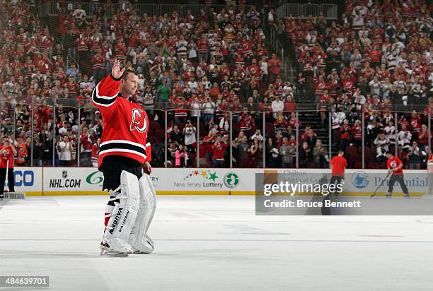 Martin Brodeur of the New Jersey Devils salutes the fan while leaving the ice following a 3-2 victory over the Boston Bruins at the Prudential Center...