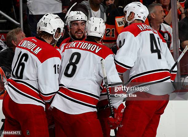 Jeff Skinner of the Carolina Hurricanes is congratulated by teammates Elias Lindholm,Andrei Loktionov,Justin Faulk and Jay Harrison in the third...