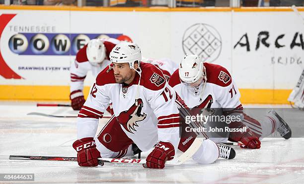 Paul Bissonnette of the Phoenix Coyotes stretch in warm ups prior to a game against the Nashville Predators at Bridgestone Arena on April 10, 2014 in...