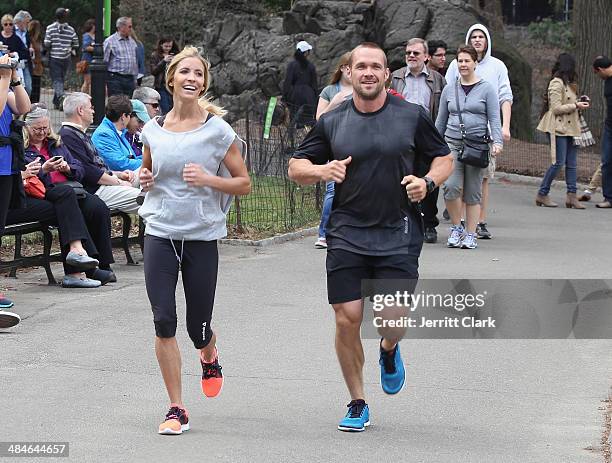 Chris Powell and wife Heidi Powell go for a run in Central Park while in NYC for the Reebok Spartan Race on April 13, 2014 in New York City.