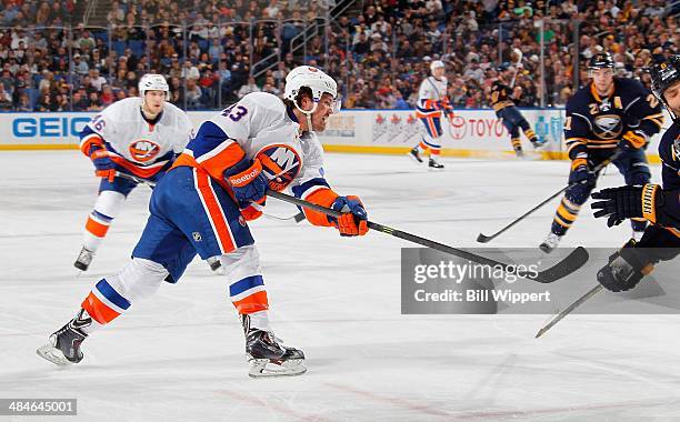 Mike Halmo of the New York Islanders shoots the puck against the Buffalo Sabres on April 13, 2014 at the First Niagara Center in Buffalo, New York.