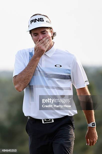 Bubba Watson of the United States walks off the 18th green after winning the 2014 Masters Tournament by a three-stroke margin at Augusta National...