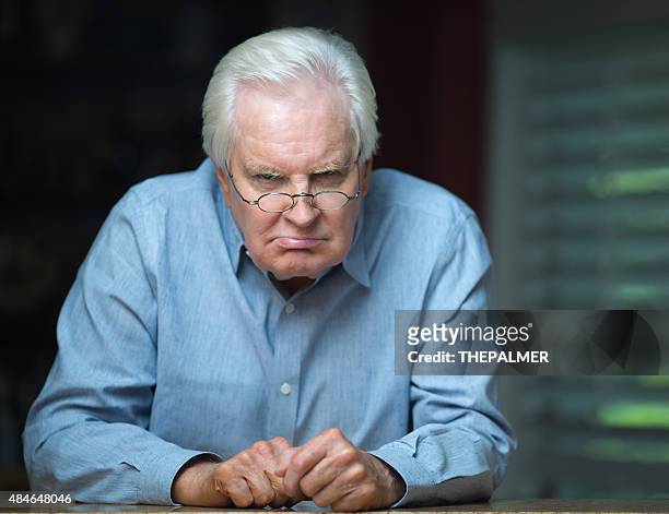 grumpy grandpa - grumpy old man stock pictures, royalty-free photos & images
