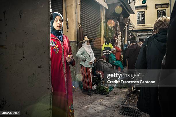 girl looks nowhere in the crowdy casbah - tangier stock pictures, royalty-free photos & images