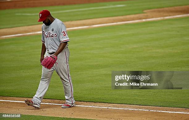 Jerome Williams of the Philadelphia Phillies walks off the field after being pulled in the second inning during a game against the Miami Marlins at...