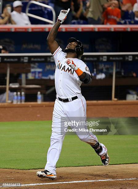 Marcell Ozuna of the Miami Marlins celebrates after hitting a two run home run during a game at Marlins Park on August 20, 2015 in Miami, Florida.