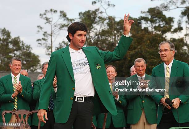 Bubba Watson of the United States poses with the green jacket after winning the 2014 Masters Tournament by a three-stroke margin at Augusta National...