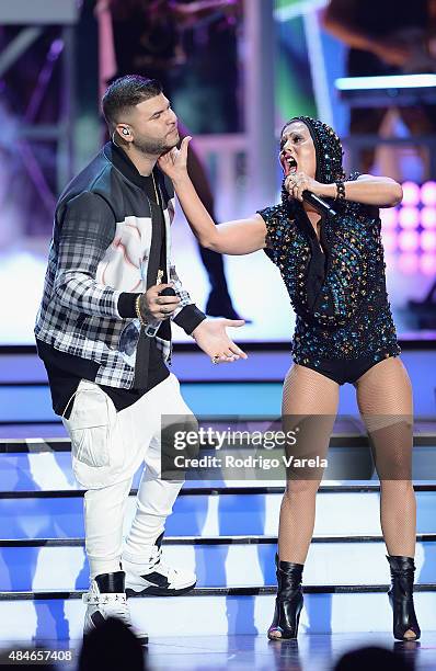 Farruko and Alejandra Guzman perform onstage at Telemundo's "Premios Tu Mundo" Awards 2015 at American Airlines Arena on August 20, 2015 in Miami,...