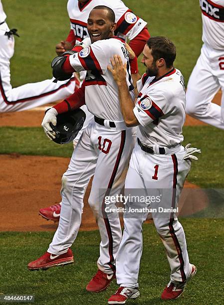 Alexei Ramirez of the Chicago White Sox celebrates with Adam Eaton after hitting a two-run, walk-off home run in the bottom of the 9th inning to...