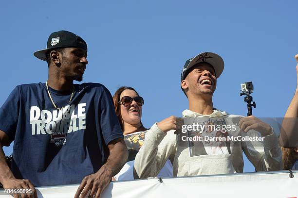 The University of Connecticut's Shabbaz Napier and DeAndre Daniels ride in a victory parade to celebrate their team's national championship April 13,...