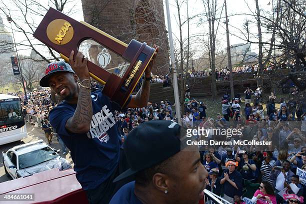 The University of Connecticut's Ryan Boatright holds the NCAA championship trophy during a victory parade to celebrate their national championship...