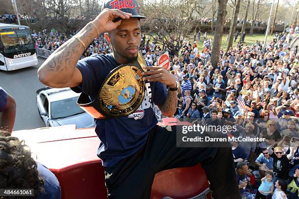 The University of Connecticut's Ryan Boatright rides in a victory parade to celebrate their national championship April 13, 2014 in Hartford,...