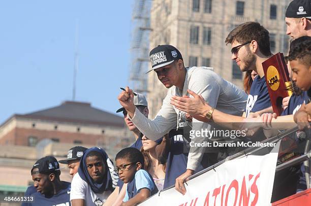 The University of Connecticut's Shabazz Napier rides in a victory parade to celebrate their national championship April 13, 2014 in Hartford,...