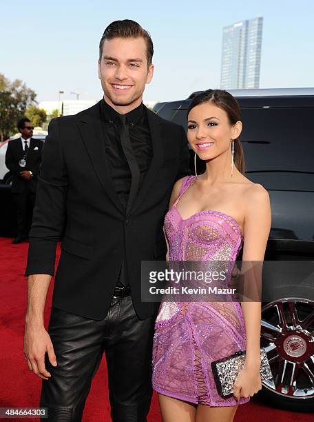 Actors Pierson Fode and Victoria Justice attend the 2014 MTV Movie Awards at Nokia Theatre L.A. Live on April 13, 2014 in Los Angeles, California.