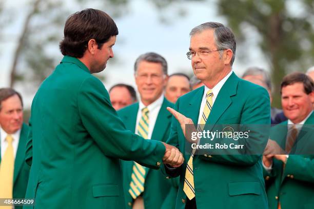 William Porter Payne , chairman of Augusta National Golf Club, shakes hands with Bubba Watson of the United States after Watson won the 2014 Masters...